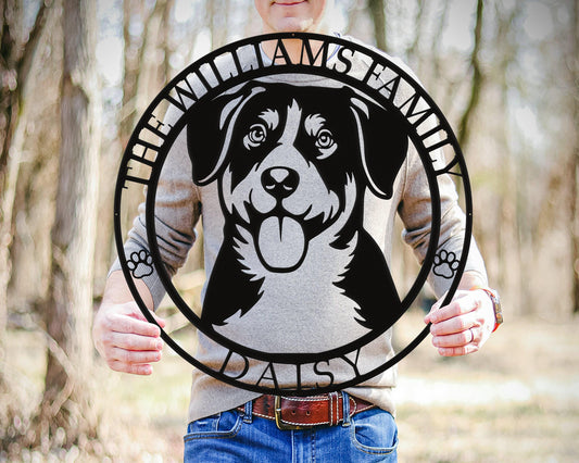 a man holding a circular sign with a dog on it